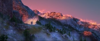 Movie still from “The Good Dinosaur” (2015), directed by Peter Sohn – A person riding a bike on top of a mountain; Extreme Wide shot, Low angle