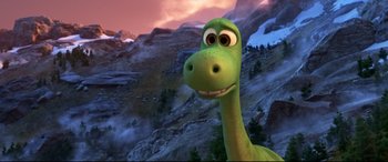Movie still from “The Good Dinosaur” (2015), directed by Peter Sohn – The head and neck of a green dinosaur; Close Up shot, High angle