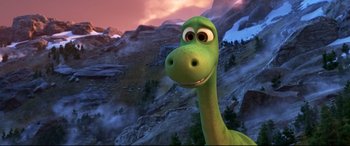 Movie still from “The Good Dinosaur” (2015), directed by Peter Sohn – The head and neck of a green dinosaur; Close Up shot, High angle