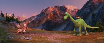 Movie still from “The Good Dinosaur” (2015), directed by Peter Sohn – An image of an animated scene with a mountain in the background; Extreme Wide shot, High angle