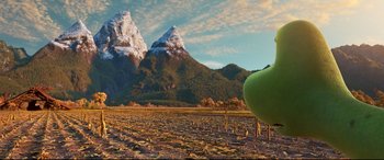 Movie still from “The Good Dinosaur” (2015), directed by Peter Sohn – An apple sitting in the middle of an open field; Extreme Wide shot, Low angle