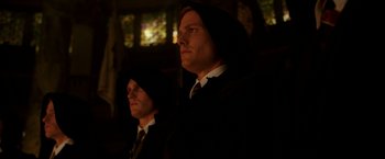 Movie still from “The Good Shepherd” (2006), directed by Robert De Niro – A man in a suit and a man in a tie; Medium shot, Low angle