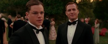 Movie still from “The Good Shepherd” (2006), directed by Robert De Niro – A couple of men in tuxedos standing next to each other; Close Up shot, Over the shoulder angle
