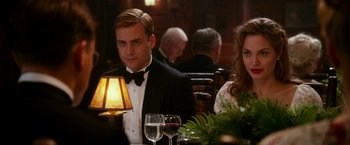 Movie still from “The Good Shepherd” (2006), directed by Robert De Niro – A man and a woman sitting at a dinner table; Medium shot, Over the shoulder angle
