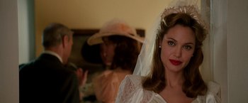 Movie still from “The Good Shepherd” (2006), directed by Robert De Niro – A woman wearing a wedding dress and a veil; Close Up shot, Over the shoulder angle