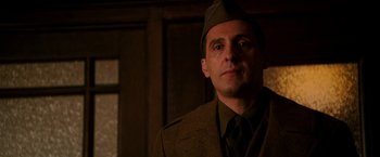 Movie still from “The Good Shepherd” (2006), directed by Robert De Niro – A person wearing a military uniform; Close Up shot, Low angle