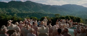 Movie still from “The Good Shepherd” (2006), directed by Robert De Niro – A group of people standing in front of a mountain; Extreme Wide shot, Over the shoulder angle