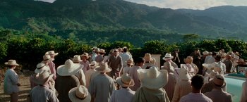 Movie still from “The Good Shepherd” (2006), directed by Robert De Niro – A group of people standing in front of a mountain; Extreme Wide shot, High angle