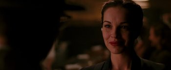 Movie still from “The Good Shepherd” (2006), directed by Robert De Niro – A woman's face in a dark room; Close Up shot, Over the shoulder angle