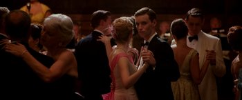 Movie still from “The Good Shepherd” (2006), directed by Robert De Niro – A man and a woman dancing at a formal event; Close Up shot, Over the shoulder angle