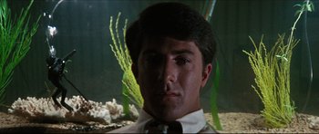 Movie still from “The Graduate” (1967), directed by Mike Nichols – A person wearing a suit and tie; Close Up shot, Low angle