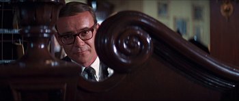 Movie still from “The Graduate” (1967), directed by Mike Nichols – A person wearing a suit and tie; Close Up shot, Low angle