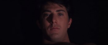 Movie still from “The Graduate” (1967), directed by Mike Nichols – A person's face in the dark; Close Up shot, High angle