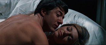 Movie still from “The Graduate” (1967), directed by Mike Nichols – A man and a woman laying in bed together; Close Up shot, Overhead angle