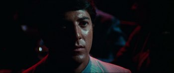 Movie still from “The Graduate” (1967), directed by Mike Nichols – A man's face in the dark; Close Up shot, Low angle