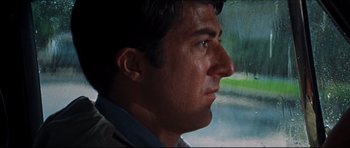 Movie still from “The Graduate” (1967), directed by Mike Nichols – A person looking out a window; Close Up shot, Low angle