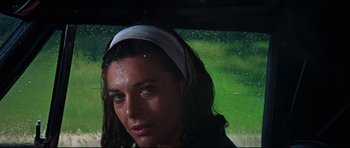 Movie still from “The Graduate” (1967), directed by Mike Nichols – A person with wet hair; Close Up shot, High angle