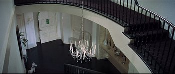 Movie still from “The Graduate” (1967), directed by Mike Nichols – A chandelier hanging from the ceiling of a room; Extreme Wide shot, Overhead angle