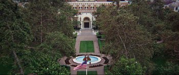 Movie still from “The Graduate” (1967), directed by Mike Nichols – An aerial view of a fountain and a building; Extreme Wide shot, High angle