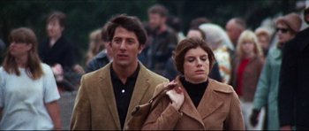 Movie still from “The Graduate” (1967), directed by Mike Nichols – A man and a woman walking down a street; Medium shot, Low angle