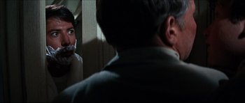 Movie still from “The Graduate” (1967), directed by Mike Nichols – A man and a woman in front of a bathroom mirror; Close Up shot, Over the shoulder angle