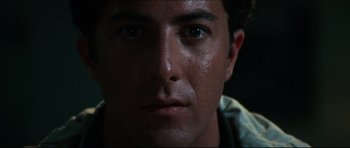 Movie still from “The Graduate” (1967), directed by Mike Nichols – A man's face in the dark; Close Up shot, High angle