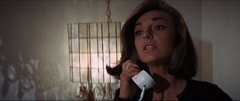 Movie still from “The Graduate” (1967), directed by Mike Nichols – A person talking on a phone; Close Up shot, Low angle
