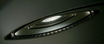 Movie still from “The Great Beauty” (2013), directed by Paolo Sorrentino – A spiral staircase with a light on the top of it; Extreme Close Up shot, Low angle