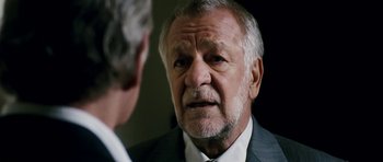 Movie still from “The Great Beauty” (2013), directed by Paolo Sorrentino – An older man wearing a suit talking to a younger man; Close Up shot, Over the shoulder angle