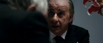 Movie still from “The Great Beauty” (2013), directed by Paolo Sorrentino – An older man in a suit and tie looking into the camera; Close Up shot, Over the shoulder angle