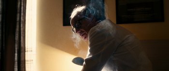 Movie still from “The Great Beauty” (2013), directed by Paolo Sorrentino – An old man wearing glasses is smoking a cigarette; Close Up shot, Low angle