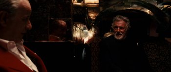 Movie still from “The Great Beauty” (2013), directed by Paolo Sorrentino – An old man with a beard is sitting in a bus; Close Up shot, Over the shoulder angle