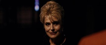 Movie still from “The Great Beauty” (2013), directed by Paolo Sorrentino – A person wearing a black shirt; Close Up shot, Over the shoulder angle