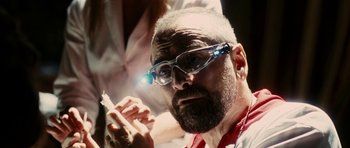 Movie still from “The Great Beauty” (2013), directed by Paolo Sorrentino – An older man with a beard and glasses is holding a cigarette; Close Up shot, Low angle