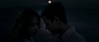 Movie still from “The Great Beauty” (2013), directed by Paolo Sorrentino – A man and a woman standing next to each other in front of a body of water at night; Close Up shot, Low angle