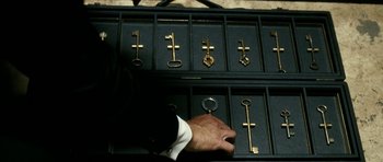 Movie still from “The Great Beauty” (2013), directed by Paolo Sorrentino – A man holding a key in his hand; Extreme Close Up shot, High angle