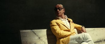 Movie still from “The Great Beauty” (2013), directed by Paolo Sorrentino – An older man in a yellow suit sitting on a bench; Medium shot, Low angle