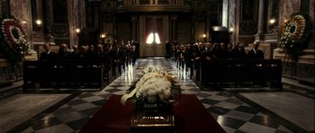 Movie still from “The Great Beauty” (2013), directed by Paolo Sorrentino – A large group of people gathered in a church for a funeral; Wide shot, High angle