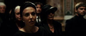 Movie still from “The Great Beauty” (2013), directed by Paolo Sorrentino – A group of people standing next to each other in a room; Close Up shot, Over the shoulder angle