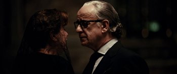 Movie still from “The Great Beauty” (2013), directed by Paolo Sorrentino – An older man wearing a suit and tie; Close Up shot, Over the shoulder angle