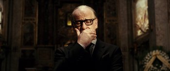 Movie still from “The Great Beauty” (2013), directed by Paolo Sorrentino – An older man in a black suit and glasses; Close Up shot, Low angle