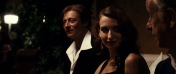 Movie still from “The Great Beauty” (2013), directed by Paolo Sorrentino – A man and a woman posing for a picture; Close Up shot, Over the shoulder angle