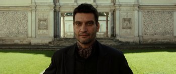 Movie still from “The Great Beauty” (2013), directed by Paolo Sorrentino – A person wearing a suit and tie; Close Up shot, Low angle