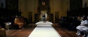 Movie still from “The Great Beauty” (2013), directed by Paolo Sorrentino – A man sitting in a chair on a runway; Extreme Wide shot, High angle