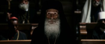 Movie still from “The Great Beauty” (2013), directed by Paolo Sorrentino – An old man with a long beard wearing a black robe; Close Up shot, High angle
