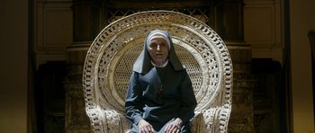 Movie still from “The Great Beauty” (2013), directed by Paolo Sorrentino – An older woman sitting in a wicker chair; Medium shot, High angle