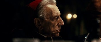 Movie still from “The Great Beauty” (2013), directed by Paolo Sorrentino – An old man with a poinsettia on his head; Close Up shot, Over the shoulder angle