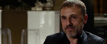 Movie still from “The Green Hornet” (2011), directed by Michel Gondry – A person wearing a black shirt; Close Up shot, Over the shoulder angle