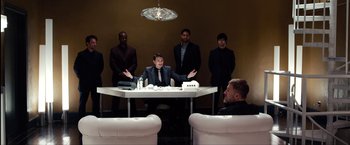 Movie still from “The Green Hornet” (2011), directed by Michel Gondry – A group of men sitting around a table; Wide shot, Over the shoulder angle