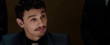 Movie still from “The Green Hornet” (2011), directed by Michel Gondry – A person wearing a suit and tie; Close Up shot, High angle